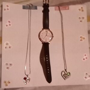 Jessica Simpson bag and a  fossil watch with a couple of necklaces